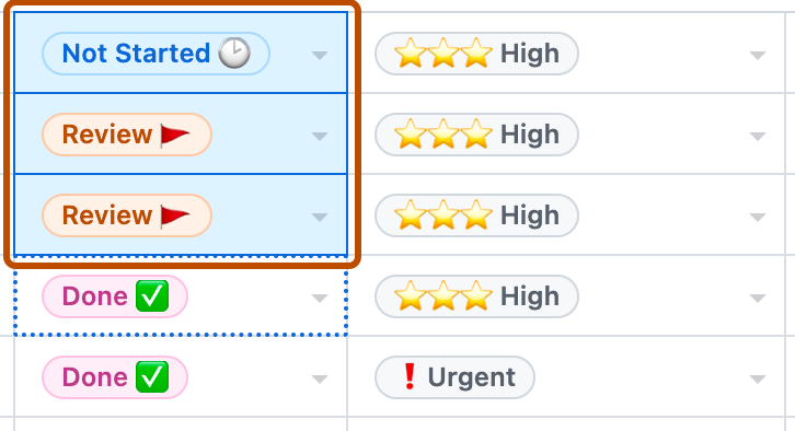 Screenshot showing two columns on a table layout. Three cells are selected and are highlighted with an orange outline.